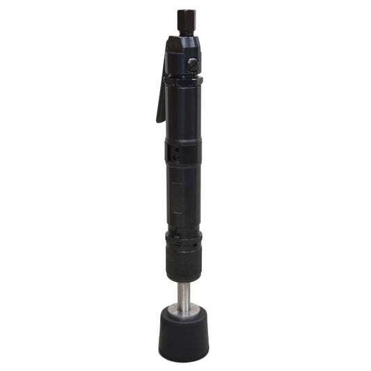 A black bench rammer with a long handle and a metal body designed for compacting soil and sand in foundry or casting facilities.